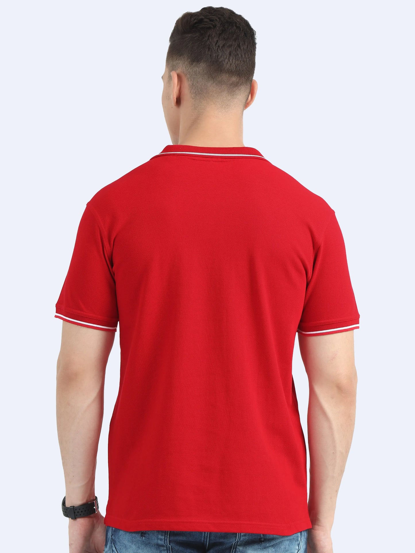 Back view of man wearing red polo t-shirt with white trim, casual promotional apparel