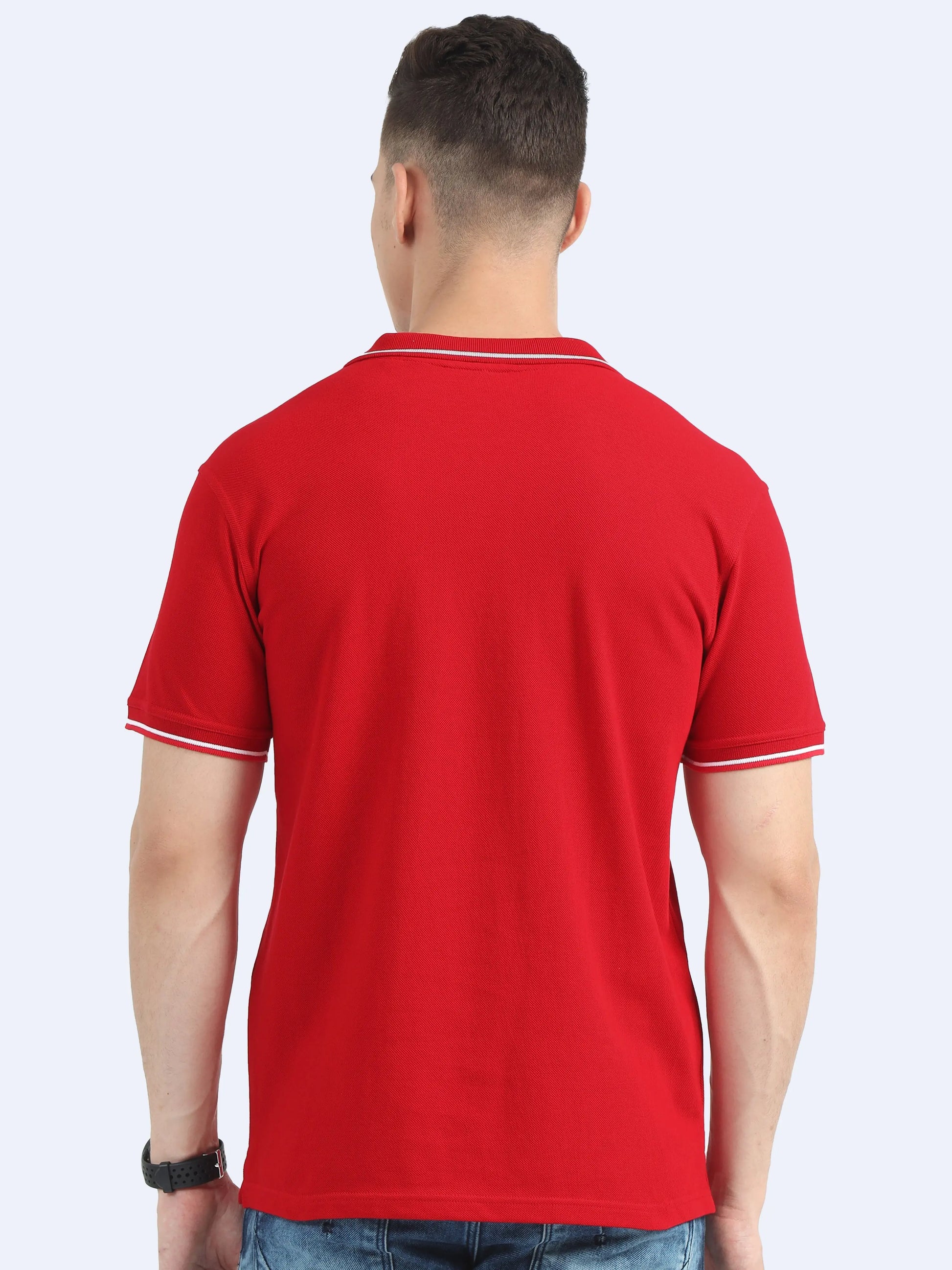 Back view of man wearing red polo t-shirt with white trim, casual promotional apparel