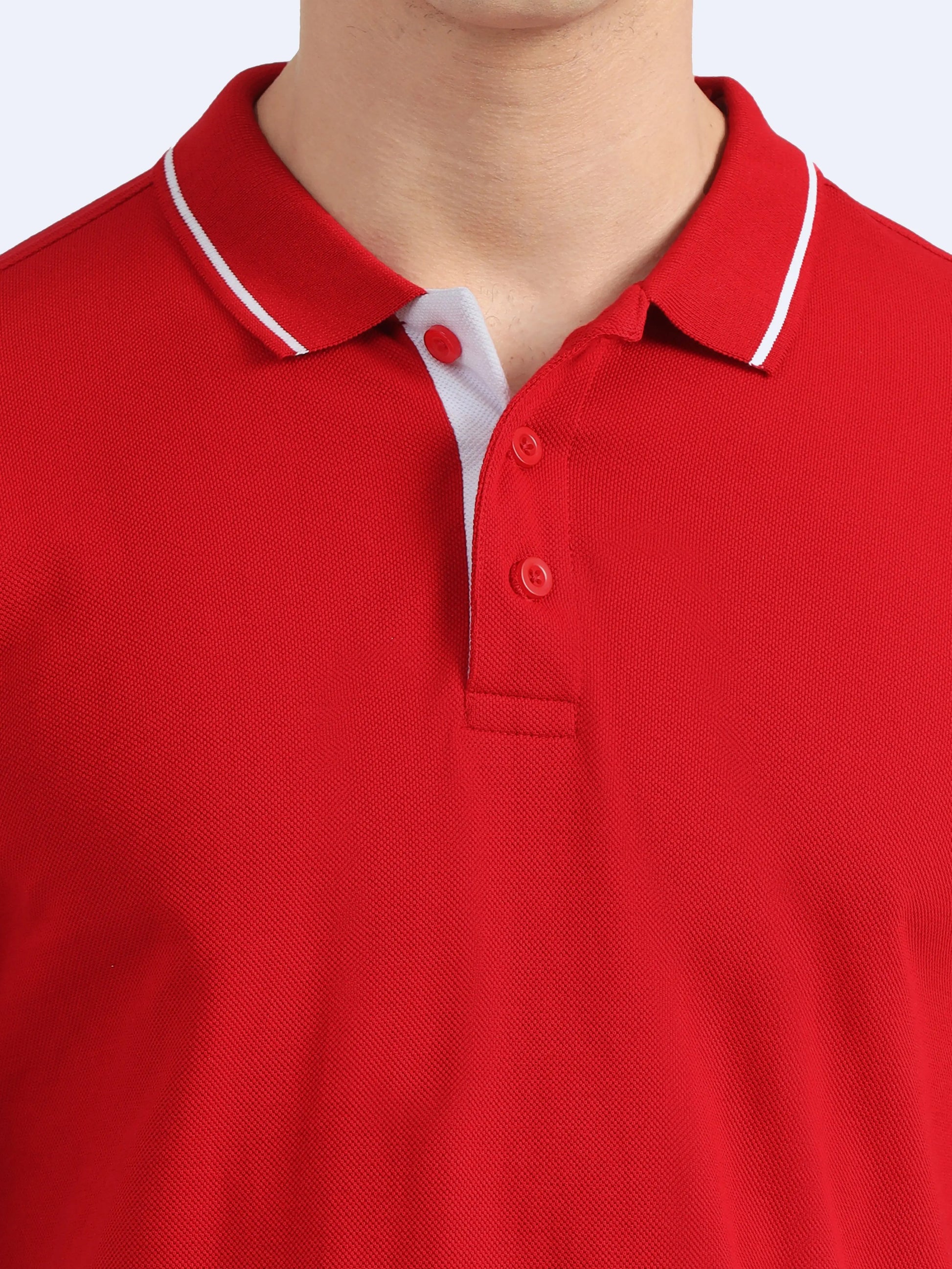 Close-up of a red polo shirt with white collar trim, ideal for corporate gifting.