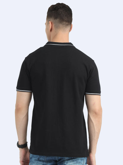 Back view of man wearing black polo t-shirt with white trim, casual corporate apparel
