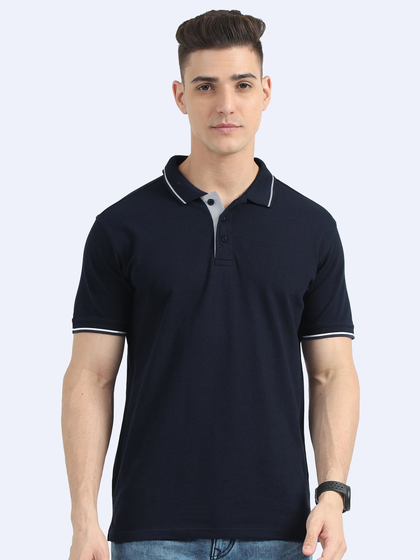 Man wearing navy blue corporate polo t-shirt with white trim, ideal for promotional apparel