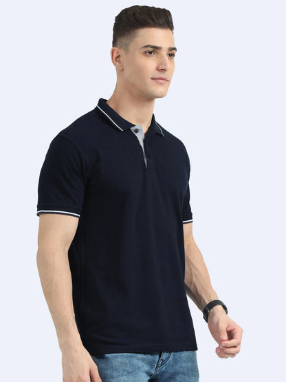 Man wearing navy blue polo t-shirt with white trim, ideal for corporate gifting or promotional apparel