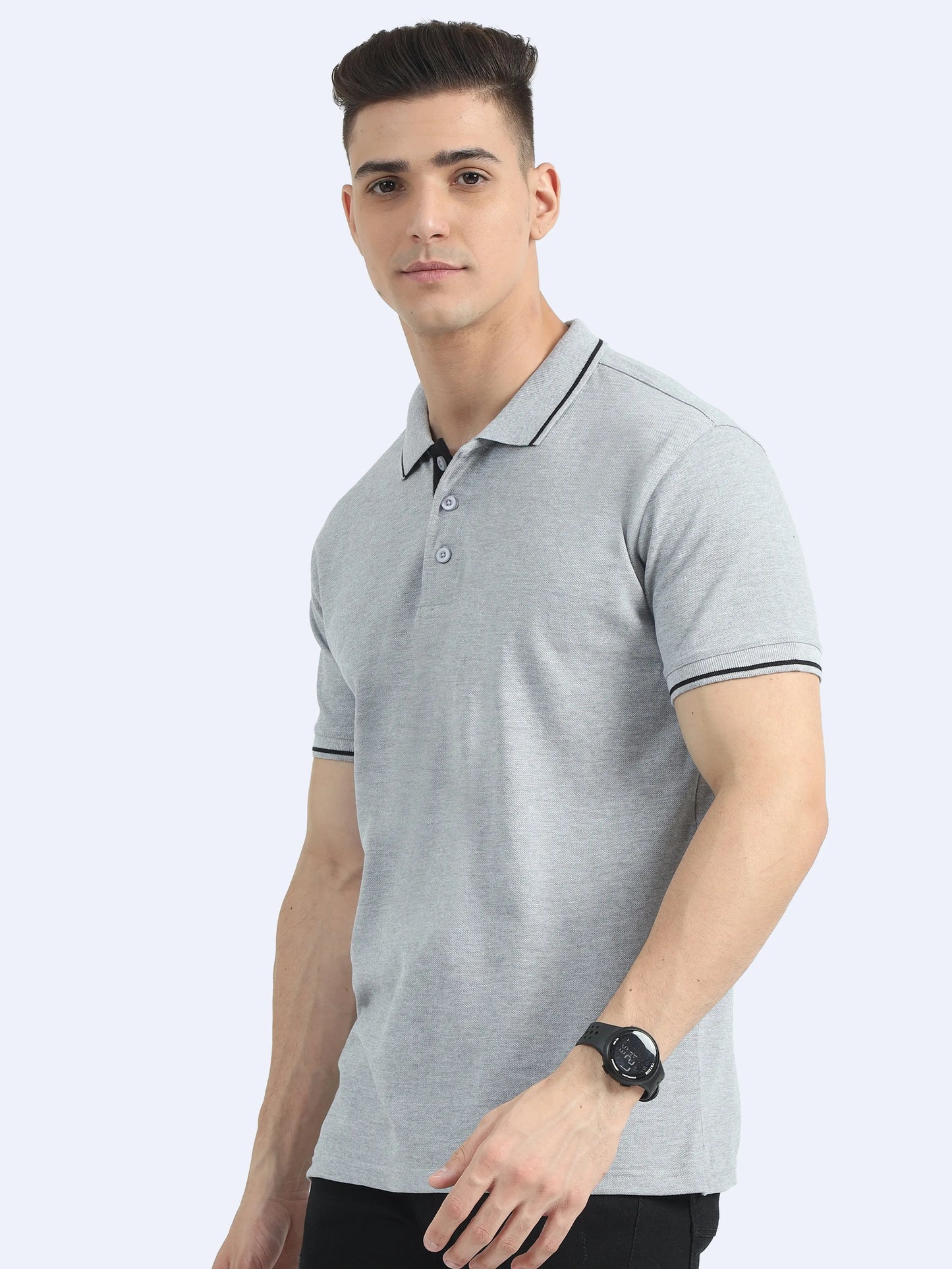 Man wearing a light grey polo shirt with black collar and sleeve trim, corporate casual apparel