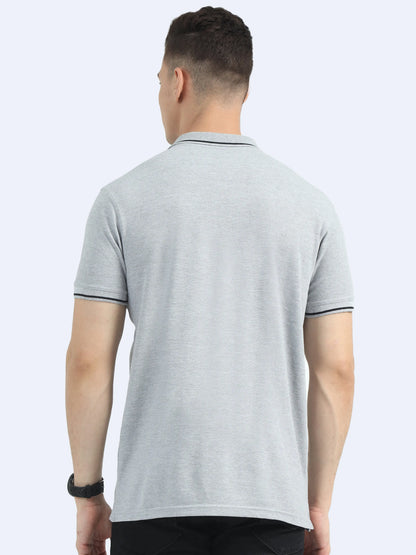 Back view of man wearing light grey polo t-shirt, ideal for corporate gifting