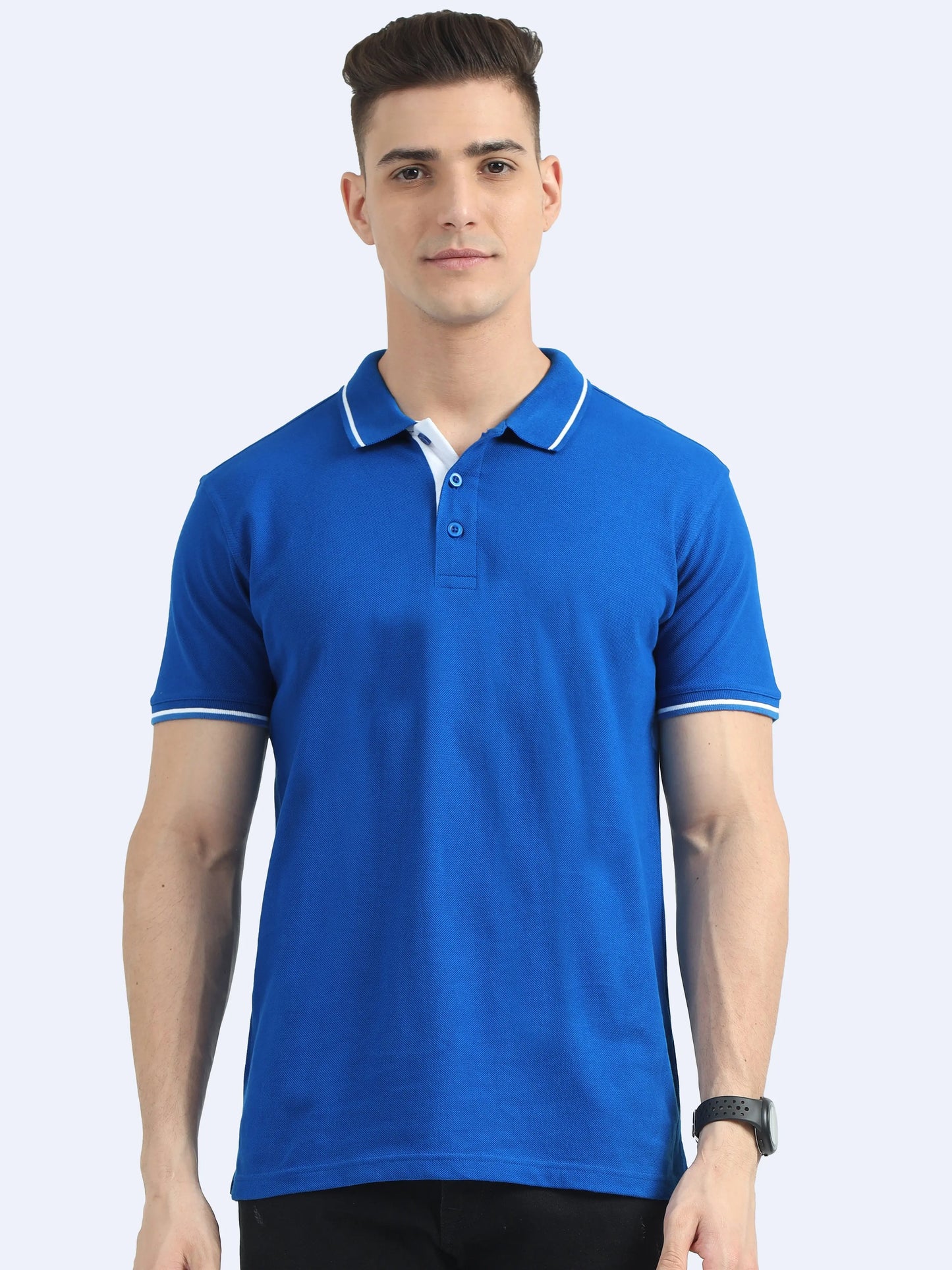 Man wearing a royal blue custom polo t-shirt with white collar accents for corporate gifting