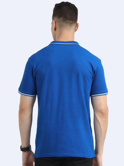 Back view of man wearing blue polo shirt with white trim, promotional apparel
