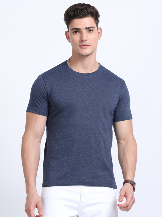 Man wearing plain navy blue crew neck t-shirt and white pants, ideal for corporate gifts