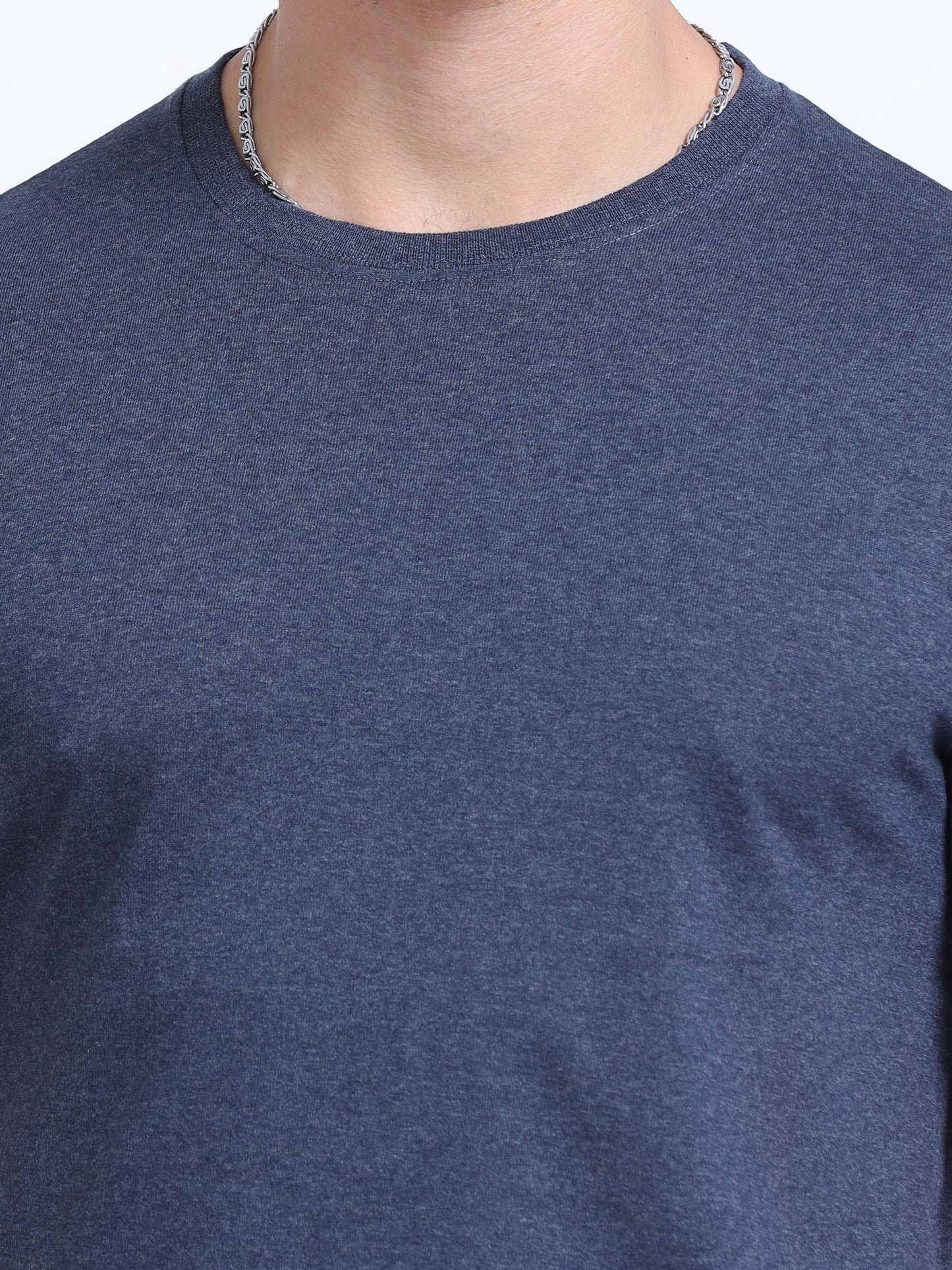 Close-up of a plain navy blue crew neck t-shirt, ideal for corporate apparel or customization.