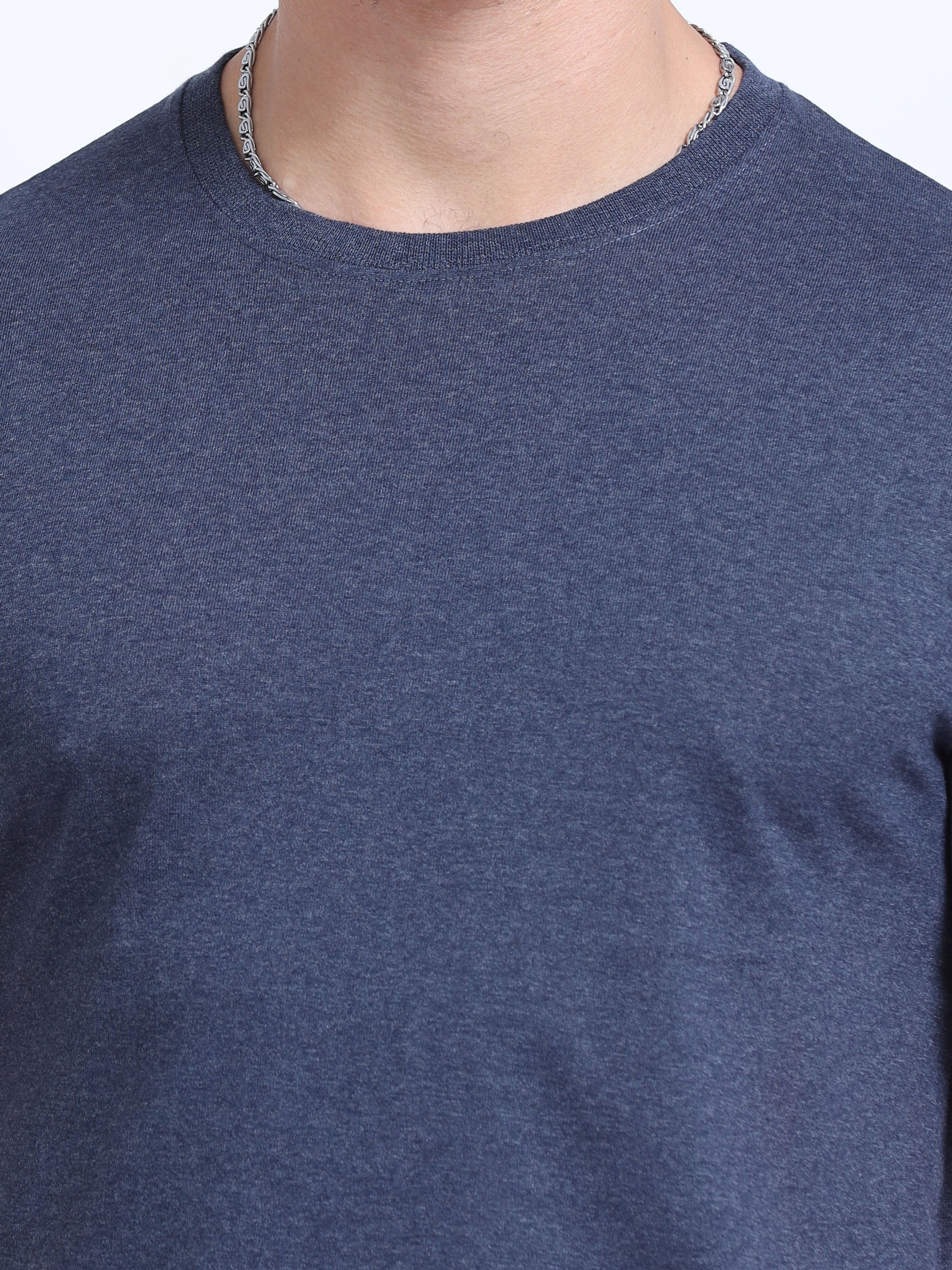 Close-up of a plain navy blue crew neck t-shirt, ideal for corporate apparel or customization.