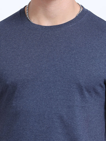 Close-up of a plain navy blue crew neck t-shirt, ideal for corporate apparel or customization.