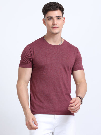 Man wearing maroon crew neck t-shirt and white pants, ideal for corporate gifting