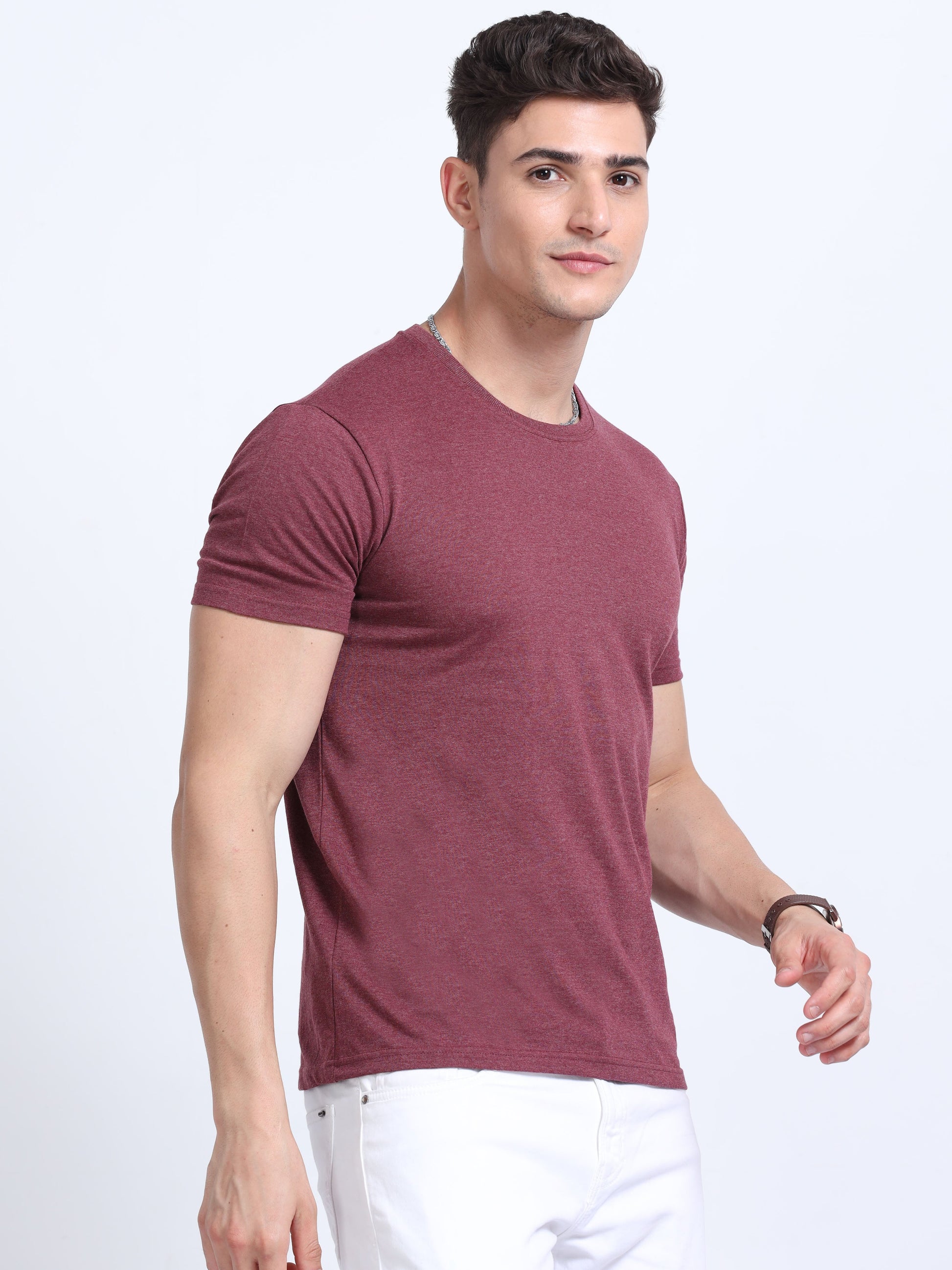 Man wearing maroon crew neck t-shirt and white pants, corporate casual apparel