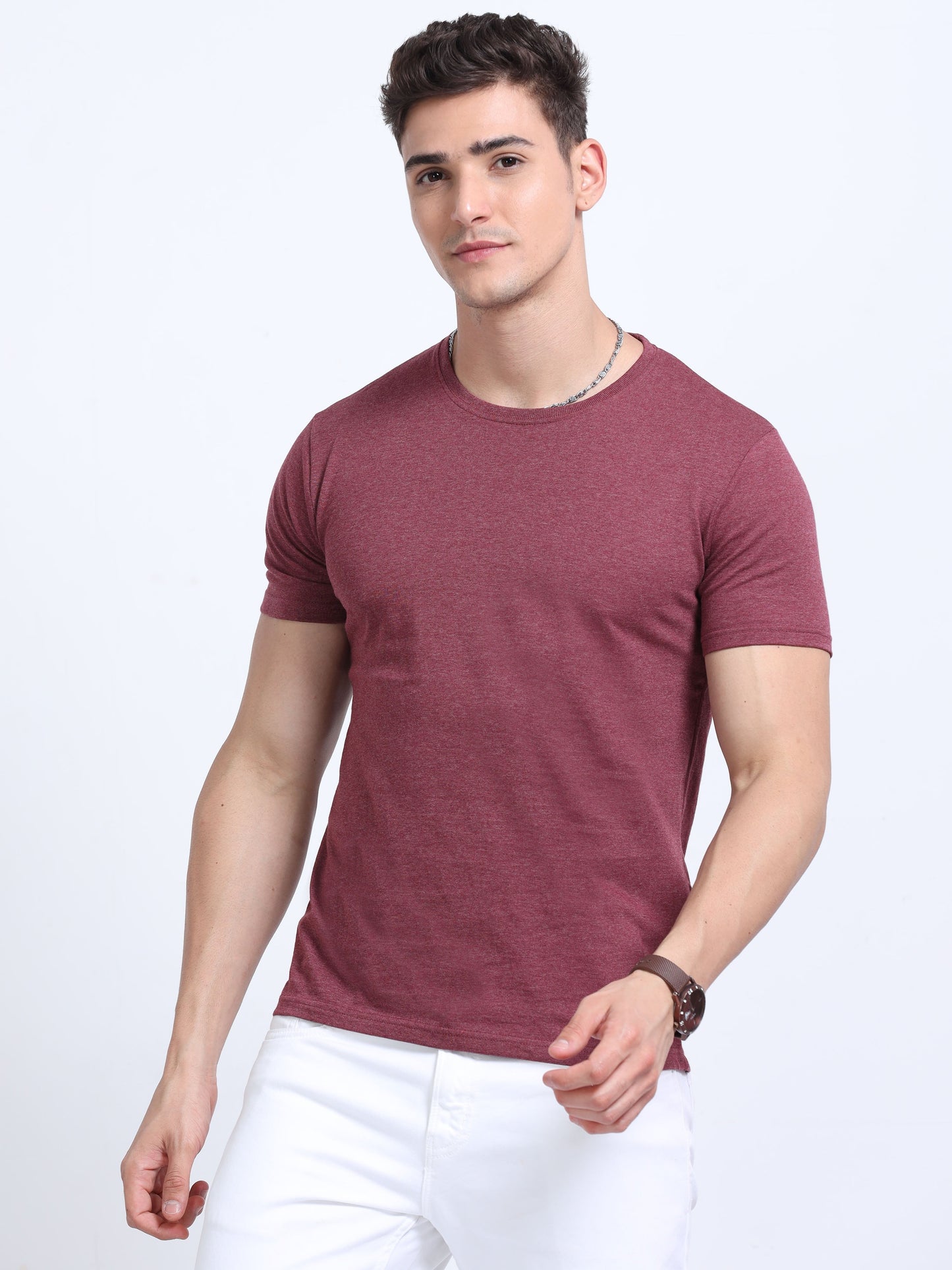 Man wearing maroon crew neck t-shirt and white pants, ideal for promotional apparel