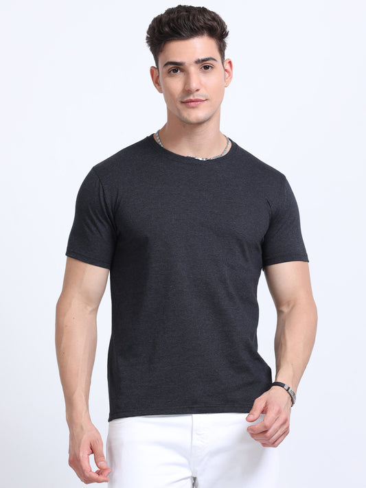 Man wearing a plain black crew neck t-shirt, ideal for custom corporate apparel