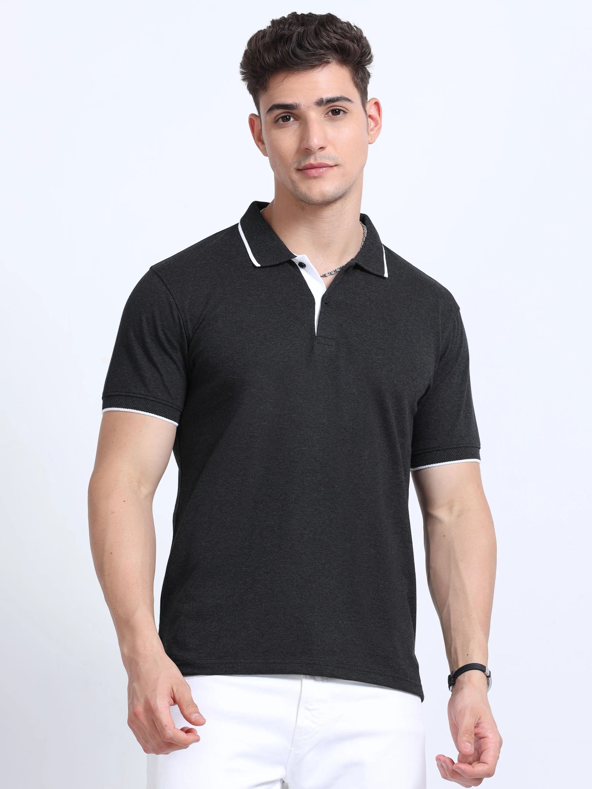 Man wearing black polo shirt with white trim, short sleeves, corporate apparel